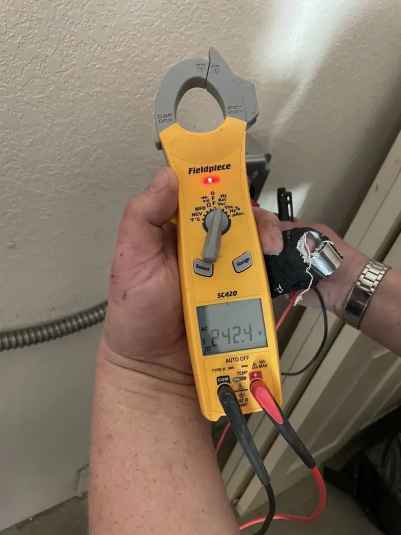 Voltage testing with clamp meter during Circuit Breaker Repair in Plymouth